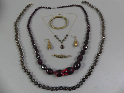 14K GOLD JEWELRY GROUP: Total 6 pieces of 14k gold-mounted jewelry: Bohemian garnet necklace; reticulated cuff bracelet; pair dangle earrings; 2 in gem-set brooch. Total 20.3 dwt not including 34 in smoky crystal necklace