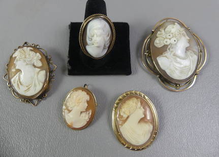 LOT 14K CAMEO BROOCHES & RING: 4 cameo brooches with 14k gold frames to 2.25 in long; plus a cameo and gold 1 inch ring. Total 24.8 dwt.