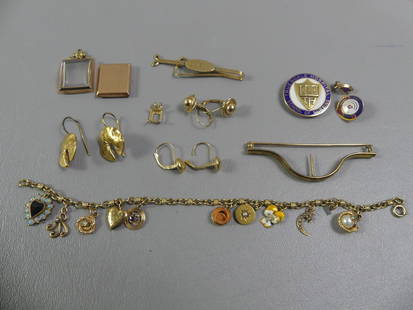 LOT ASSORTED GOLD JEWELRY: Lot mostly 14k gold jewelry including: 7 in Victorian charm bracelet; watch; earrings; tie clip; brooch (22.4 dwt incl. crystal on watch) plus 3 enameled 10k pieces (7 dwt). Total 29.4 dwt.