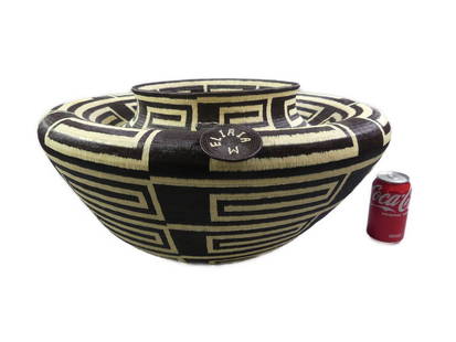 LARGE E. MEPAQUITO RAINFOREST BASKET: A large, finely crafted rainforest basket in chocolate brown with cream-colored geometric designs by Wounaan weaver Eliria Mepaquito (born 1977) of Aruza in Panama. Hand made with traditional coil