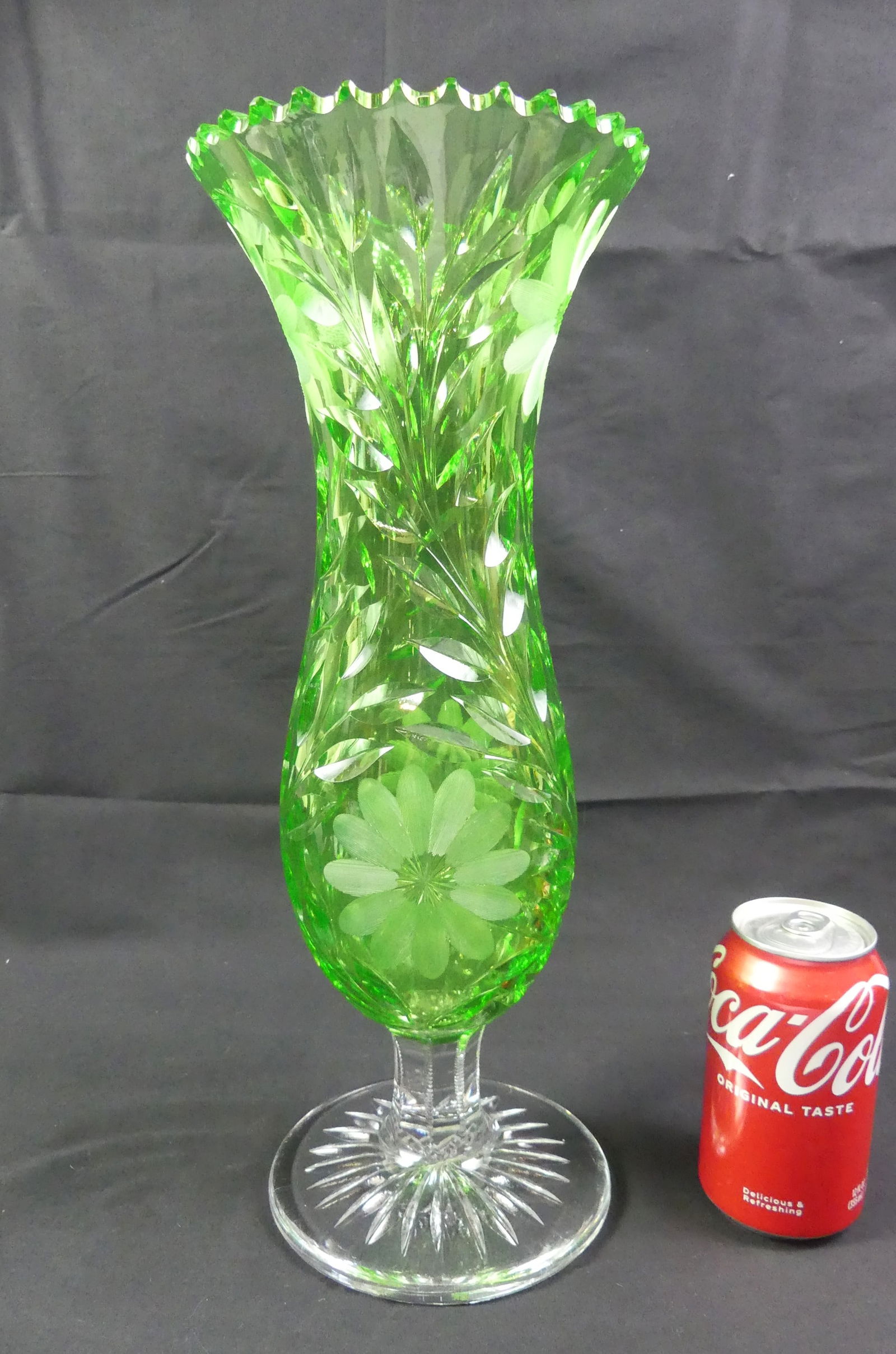 LARGE GREEN & CLEAR CUT GLASS VASE: Impressive American late Brilliant Period cut glass vase with shaped body in green vaseline (bright green uranium under UV light) with colorless base. Possibly by Pairpoint. Size: 15.5 in tall and 6 i