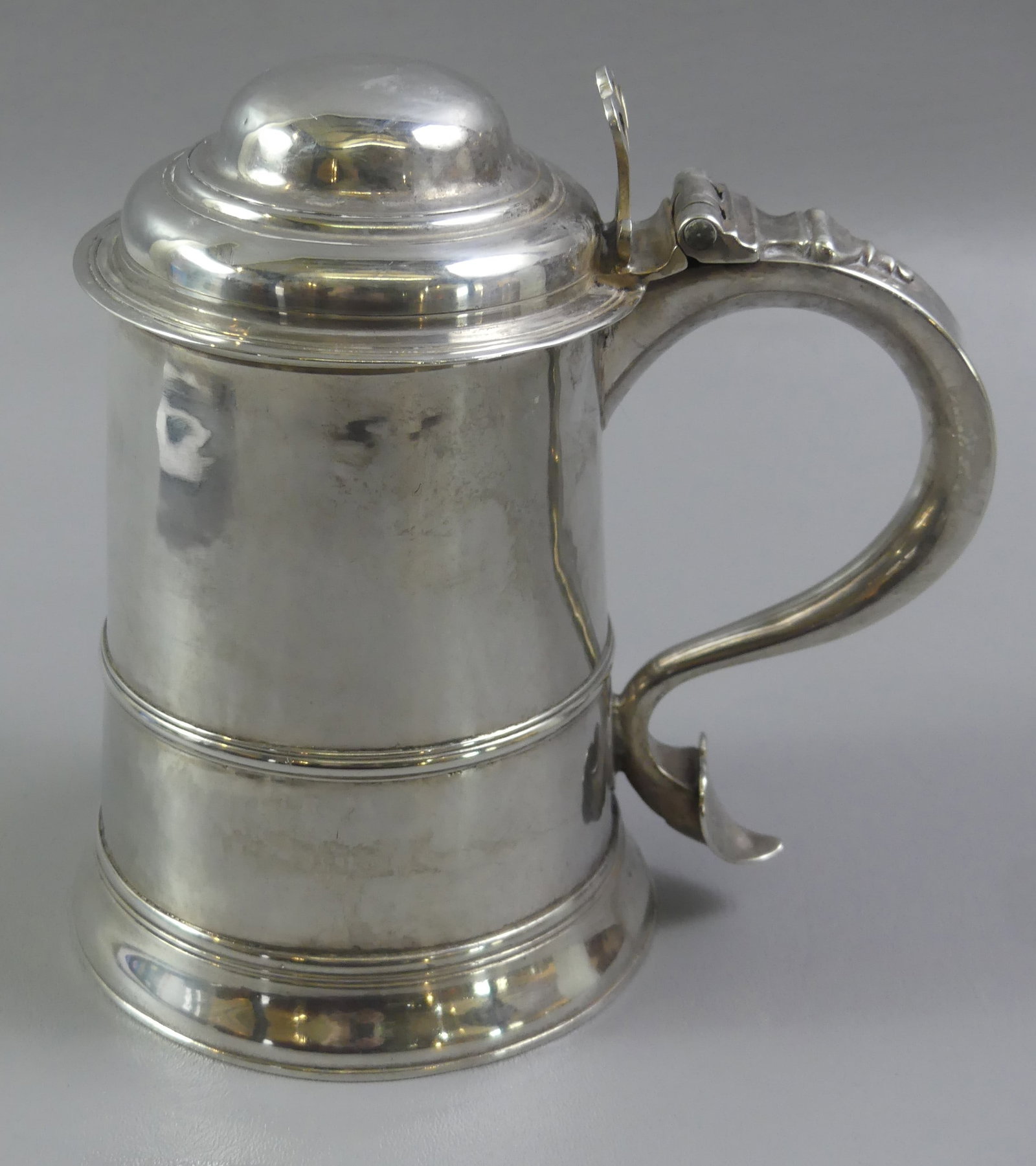 GEORGE III STERLING TANKARD - WHIPHAM: 18th century English George III sterling silver lidded tankard with heart finial on handle, hallmarks of Charles Wright and Thomas Whipham. Weighs 25.7 ozt. 7 in high by 5 in across base. VG condition