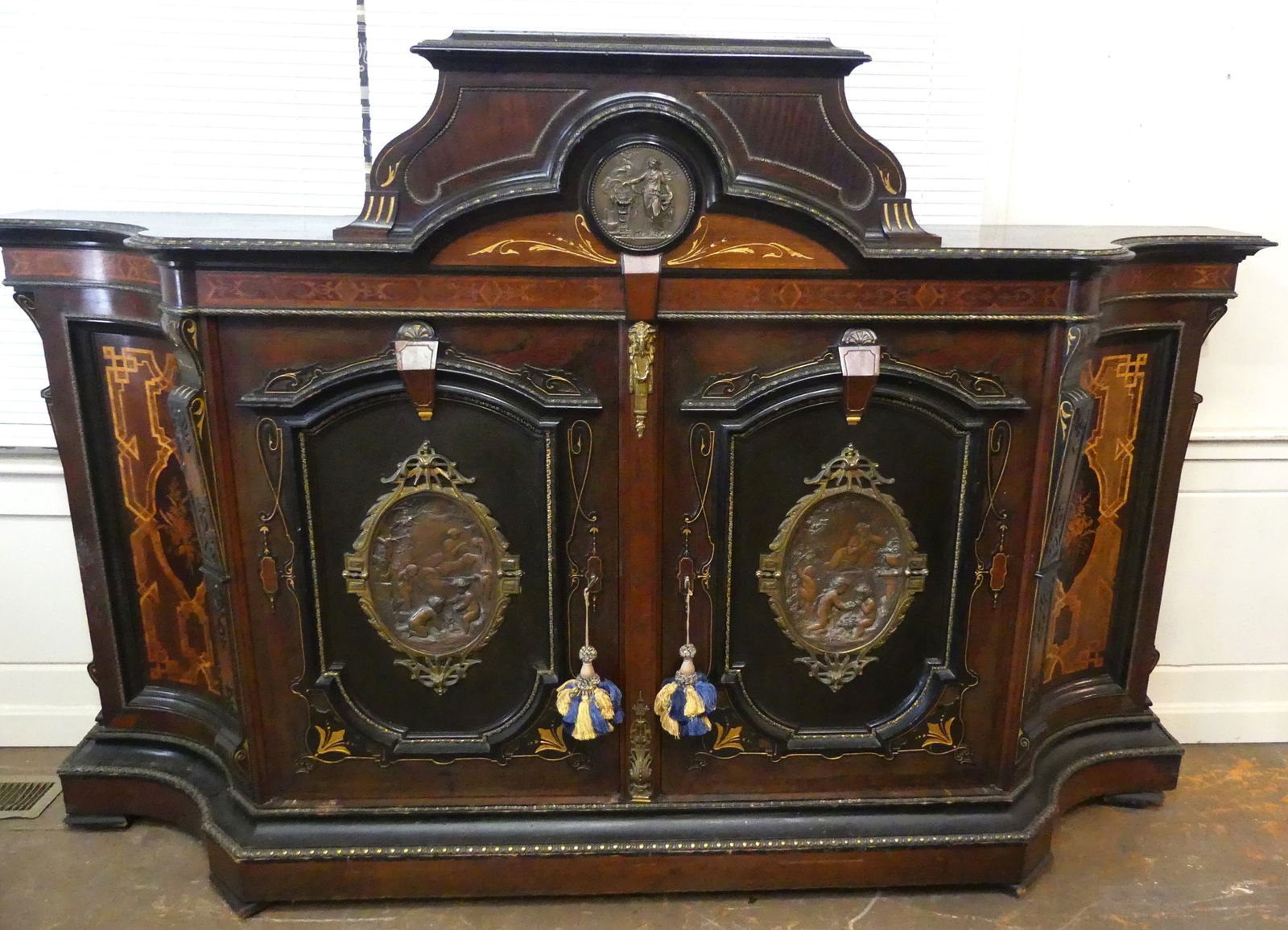 VICTORIAN POTTIER & STYMUS CREDENZA: Exquisite Victorian credenza attributed to Pottier and Stymus in walnut and rosewood with birdseye maple interior. Has 3 bronze classical plaques mounted on the front and brass trim. 80 in long x 54 h