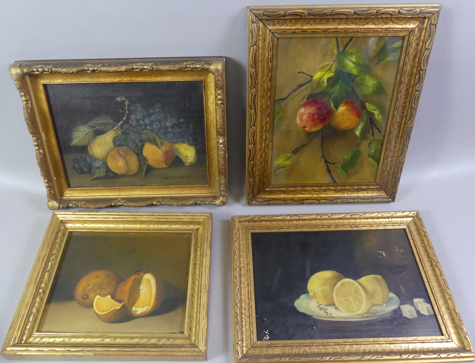 4 OLD STILL LIFE PAINTINGS - FRUIT: Lot 4 small antique still life paintings, sizes are without frames: Fruits signed Lucy Florence Young, 9 x 12 in; 2 oranges signed E. Wilder 1896, 8 x 10 in (on board); Unsigned wine and lemons, 12.5 