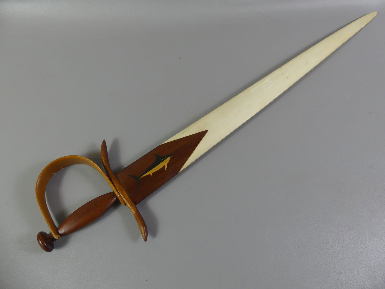 SWORD FISH BILL SWORD: Old swordfish bill with painted fish and pine handle, mounted as decorative sword. 34 in long.