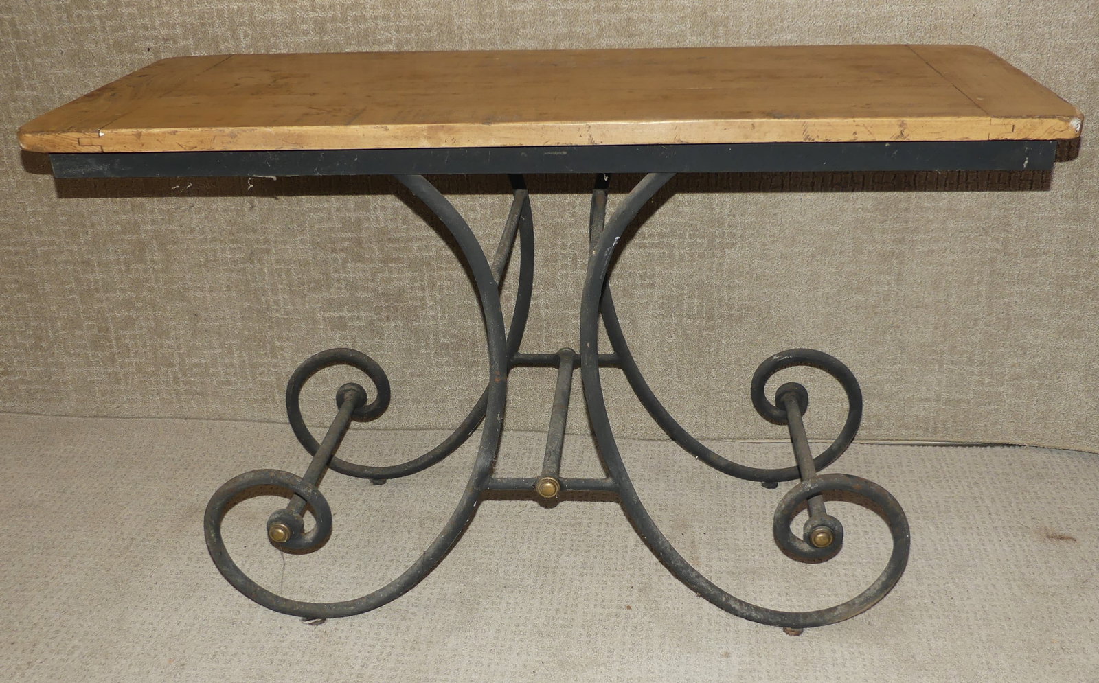 FRENCH IRON & WOOD BAKERS TABLE: Old French bakers table with wroought iron scroll base and wood top. 50 in long x 20 x 29.5 in high.