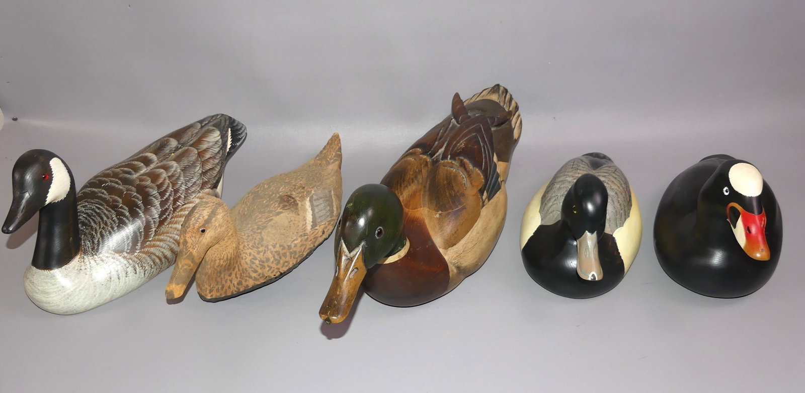 5 VINTAGE DECOYS TO 22 IN LONG: Lot 5 vintage wood decoys: Ducks Unlimited signed Tom Taler, Special Edition 1987-88; 3 signd Duck Stamp Series, Sport'em Art Decoys IL - Canada Goose, Bluebill, Surf Scoter; and old covered cork, pai