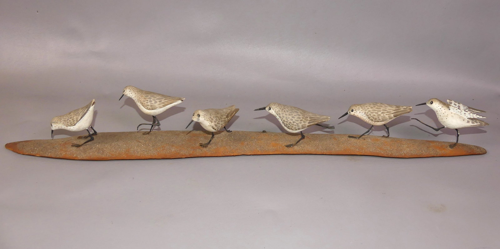 ROSENCRANZ SHORE BIRD CARVINGS: Group of 6 old painted wood Sanderling shore bird figures mounted on driftwood signed Donald Rosencrantz, Essex CT 1977. 28 in long and 3.5 in high