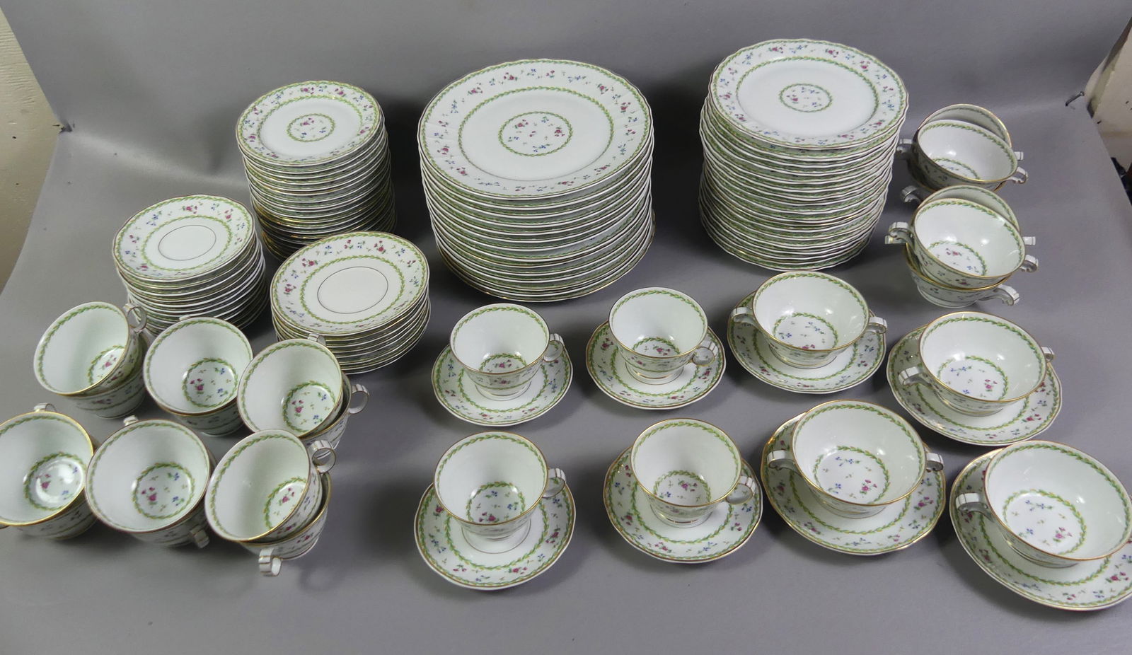 BERNARDAUD LIMOGES ARTOIS DINNER SET: Lovely 106 piece Bernardaud Limoges French porcelain dinner set with colorful scattered flowers design in the ARTOIS (Verte) pattern after an 18th century design. Consists of 14 dinner plates 10.25 in