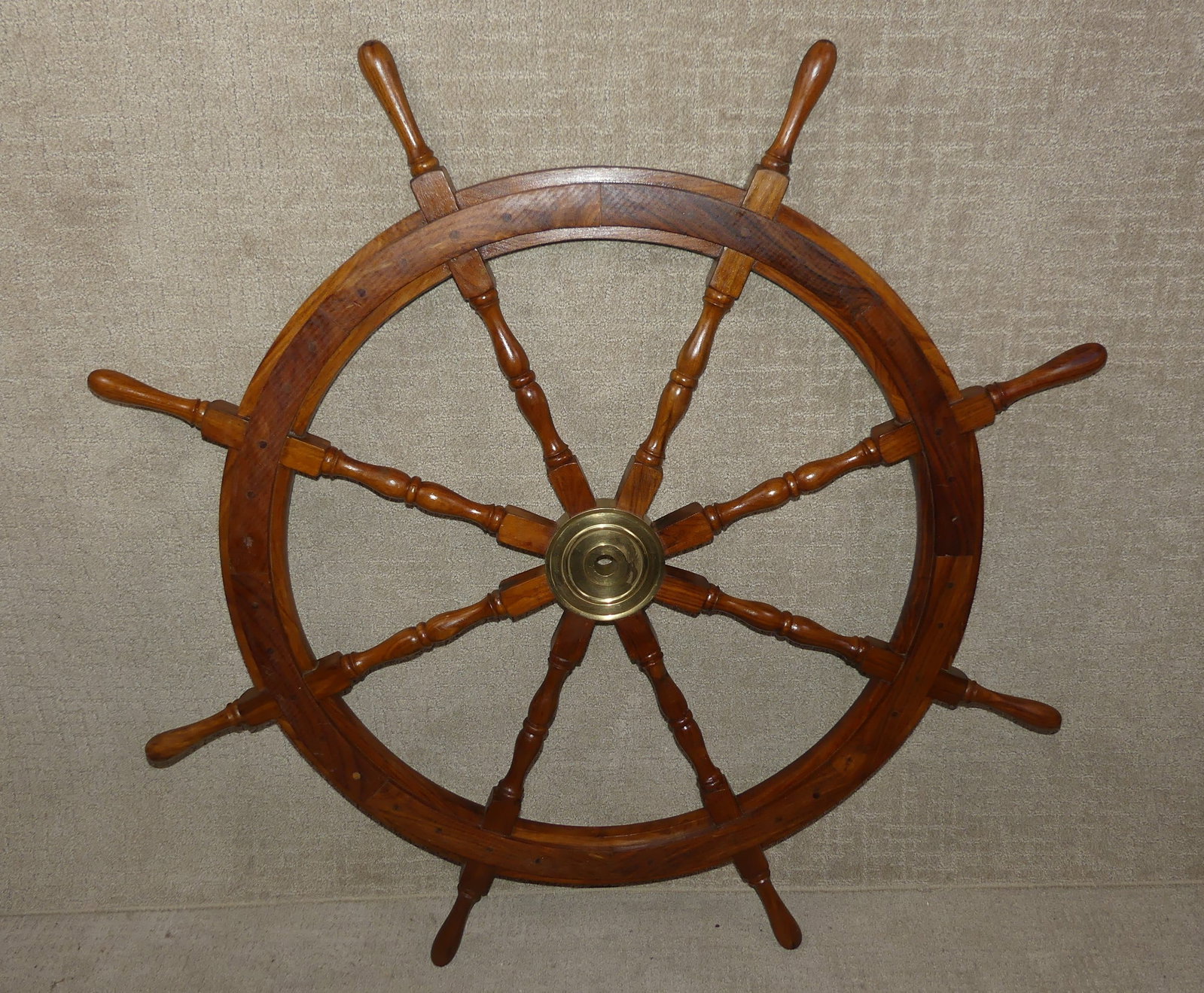 4 FT SHIPS WHEEL: Old hardwood ships wheel with brass hub. 4 ft diameter.