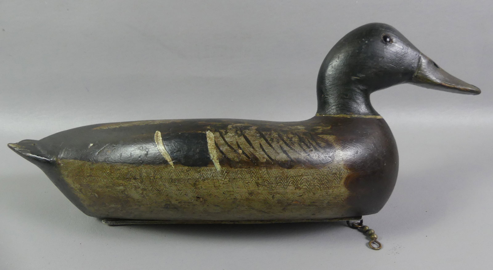 BERT GRAVES OF IL DECOY: Carved and painted mallard duck with glass eyes, 16.5 in long circa 1930's. Signed on weight --B. Graves Decoy Co. Peoria Ill. Owner stencil FWS on bottom. Good condition, original paint with some wea
