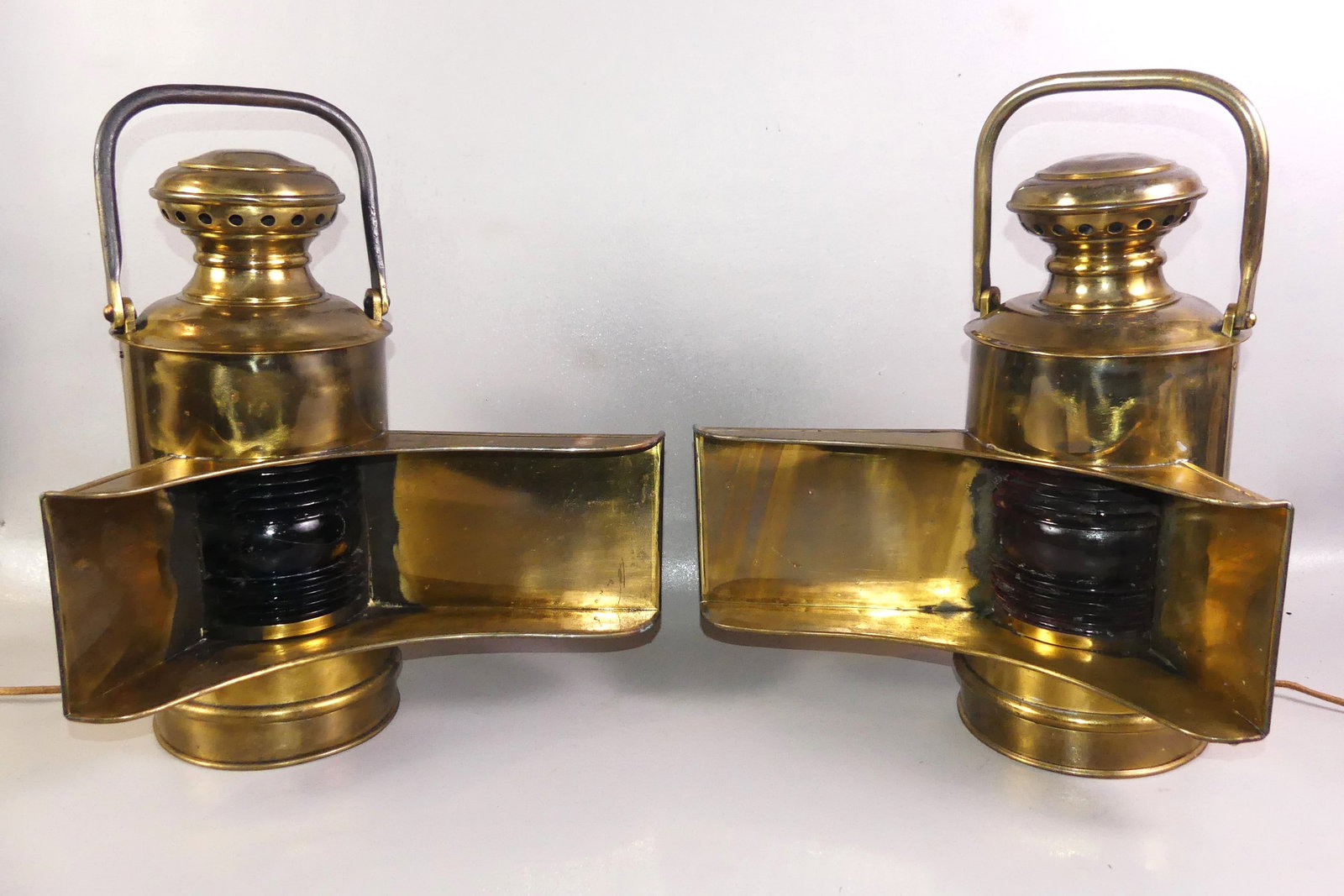 PAIR BRASS SHIP WING LANTERNS: Pair of scarce antique brass red and blue ship wing lanterns (port and starboard). 18 in wide by 15 in high. Electrified. VG condition