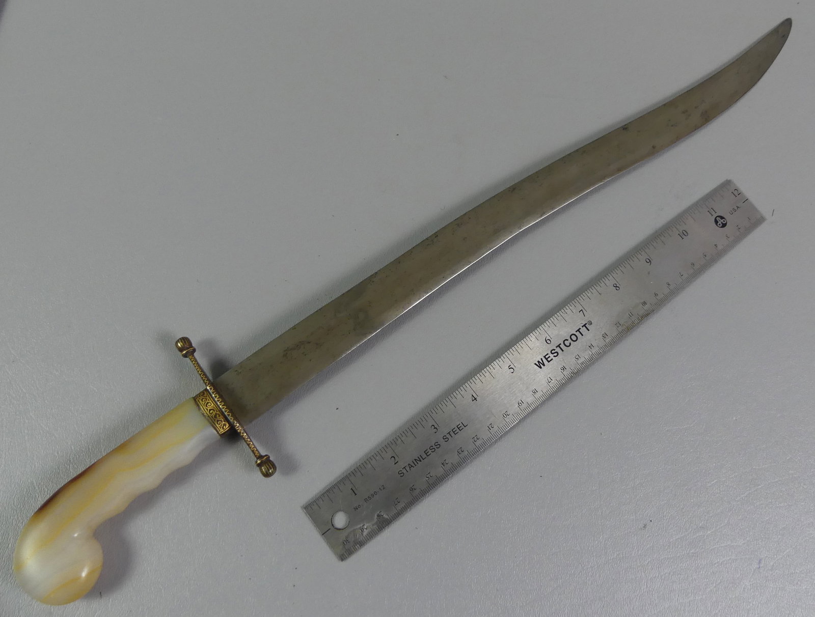 OTTOMAN EMPIRE SHORT SWORD: Antique agate-handled short sword or Yataghan with gold inlaid guard. 21 in long with curved blade. Attr. Turkish