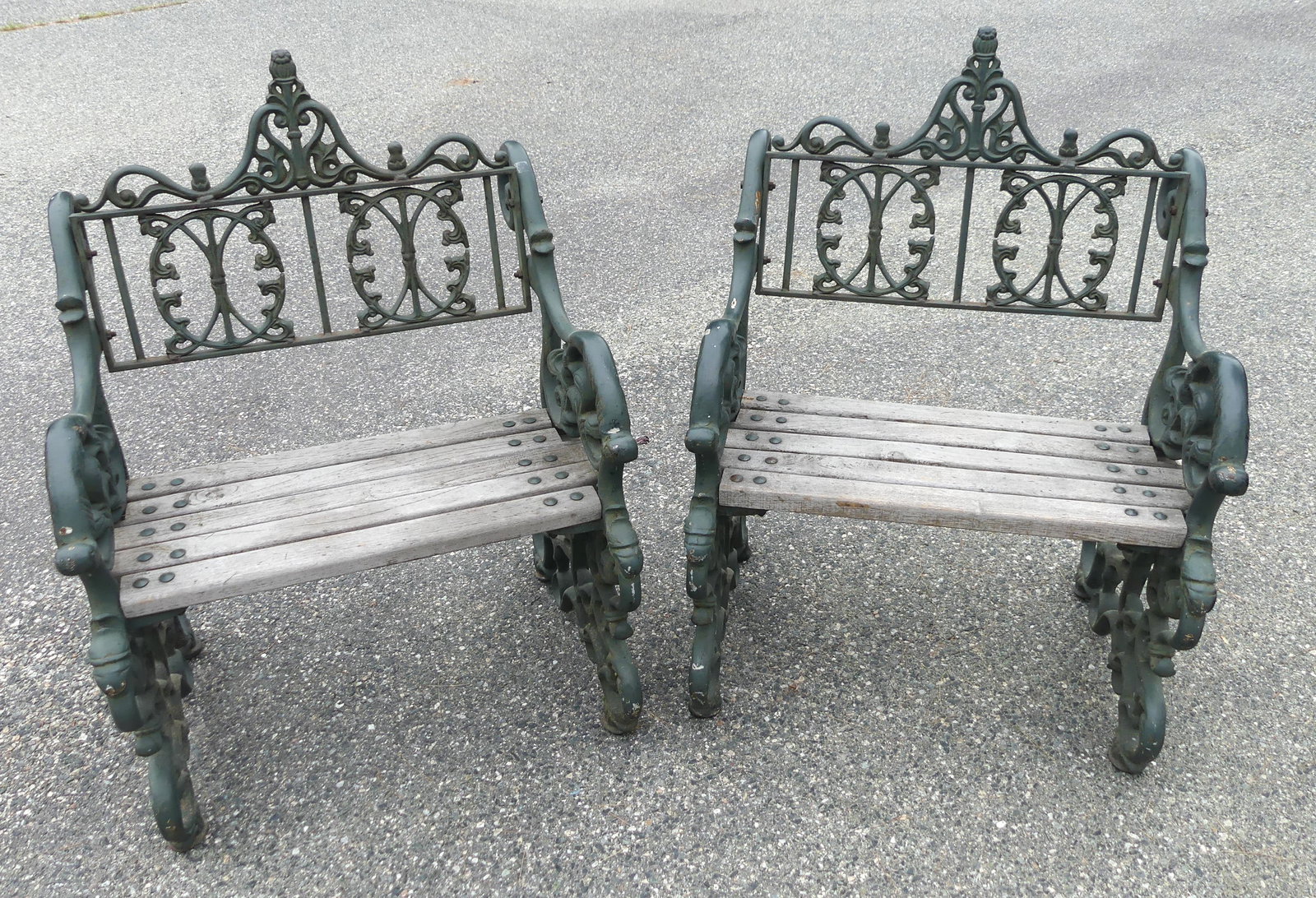 PAIR ANTIQUE IRON & WOOD GARDEN CHAIRS: Pair of very heavy, fancy iron and wood Victorian garden armchairs, possibly Coalbrookdale. 28 in w x 39 h x 25 d. VG condition.