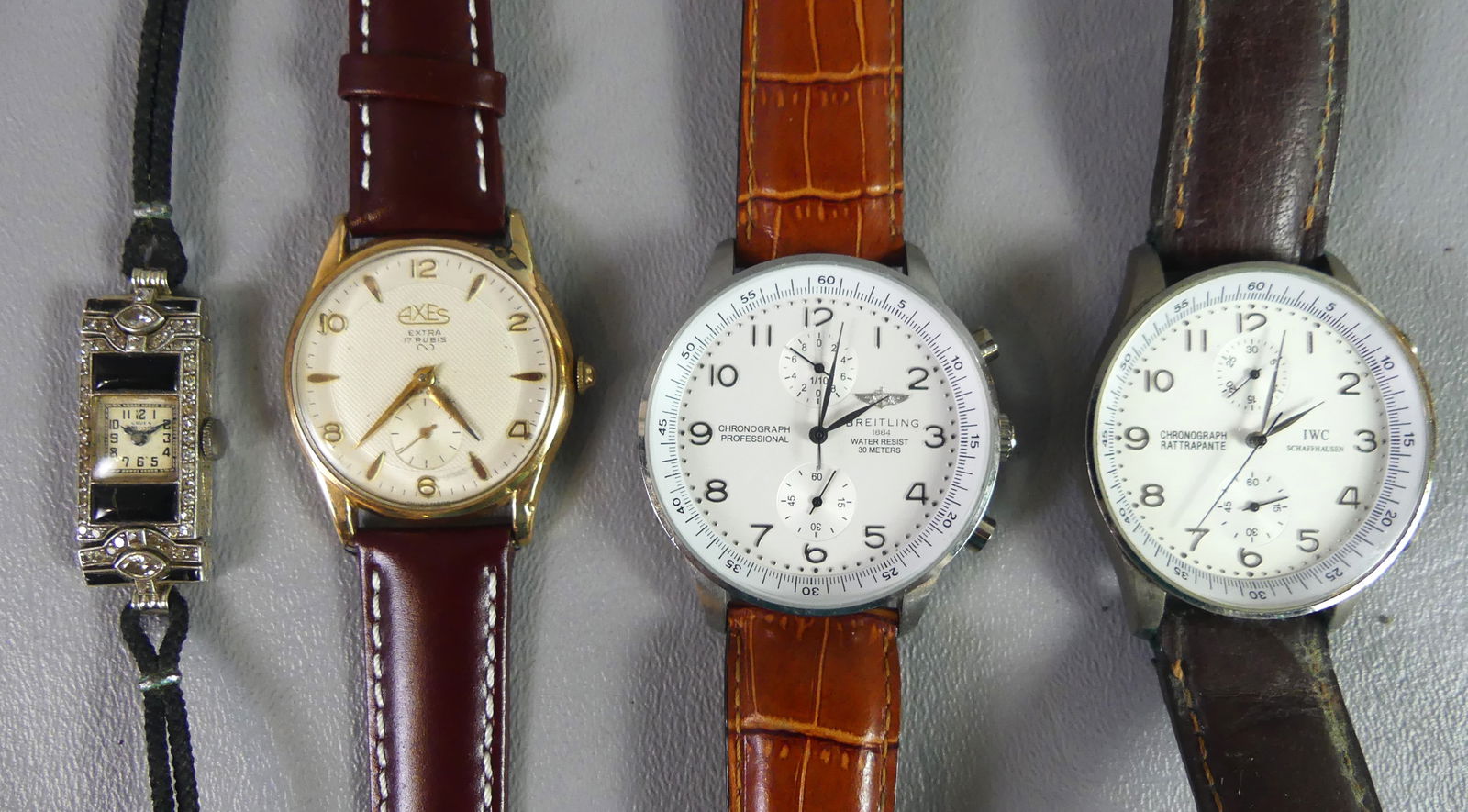 GROUP OF 4 WATCHES: 4 assorted wristwatches: Breitling AK-III Swiss quartz stainless steel chronograph; IWC Schaffhausen chronograph with stainless steel body, leather strap worn; Axes gold plated 17 jewel watch; and a l