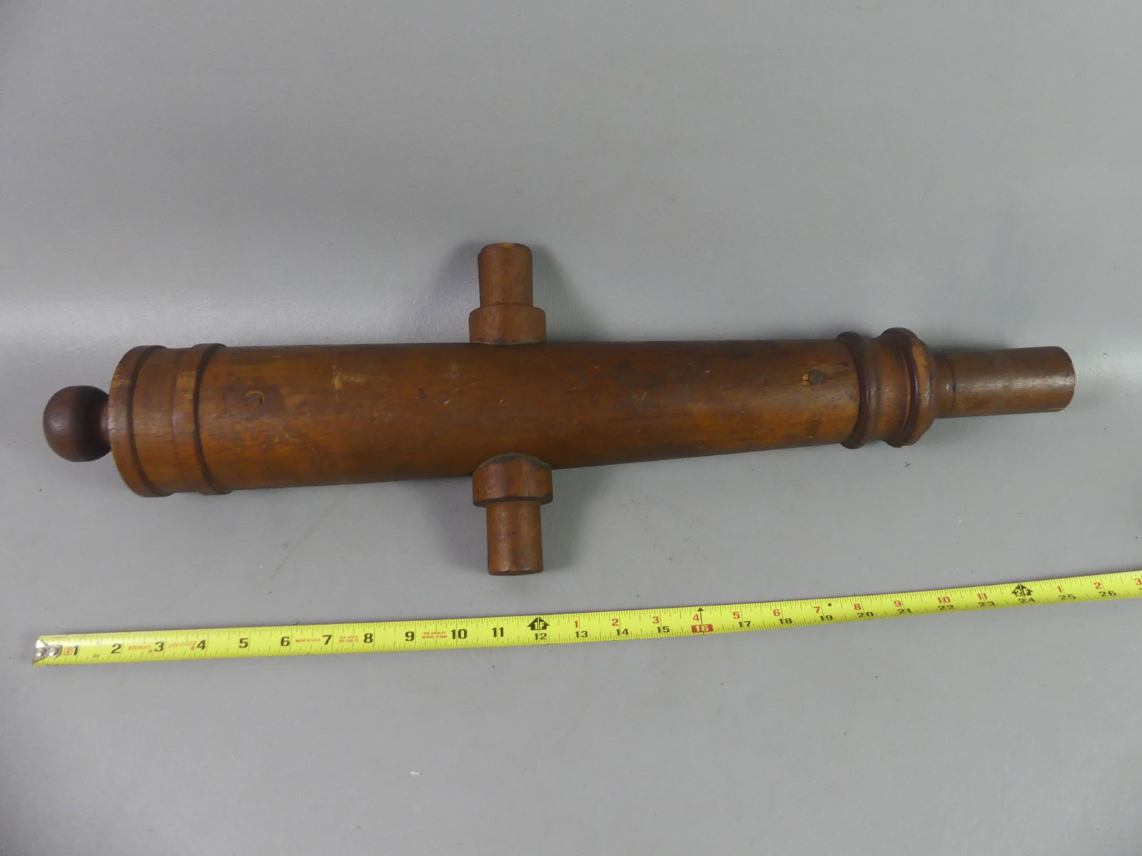 ANTIQUE WOOD CANNON MOLD: 19th century walnut two-part cannon mold, 26 in long.