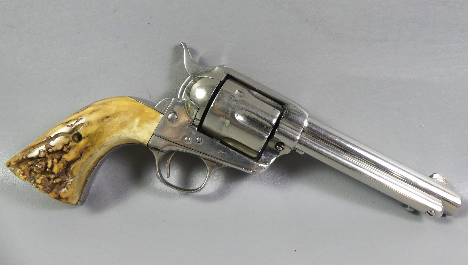 OLD GUNFIGHTER 45 COLT REVOLVER 1903: Antique 6 shot single action chrome-plated revolver stamped COLT PT. FA MFG CO. H---- USA with 4.75 in barrel, 11.5 in overall. Three matching serial numbers 244200. Latest patent date Jan. 19, 1875. 
