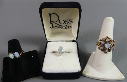 LOT THREE OPAL AND GOLD RINGS