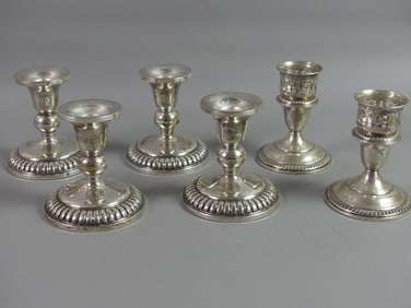 4 WEIGHTED STERLING CANDLESTICKS