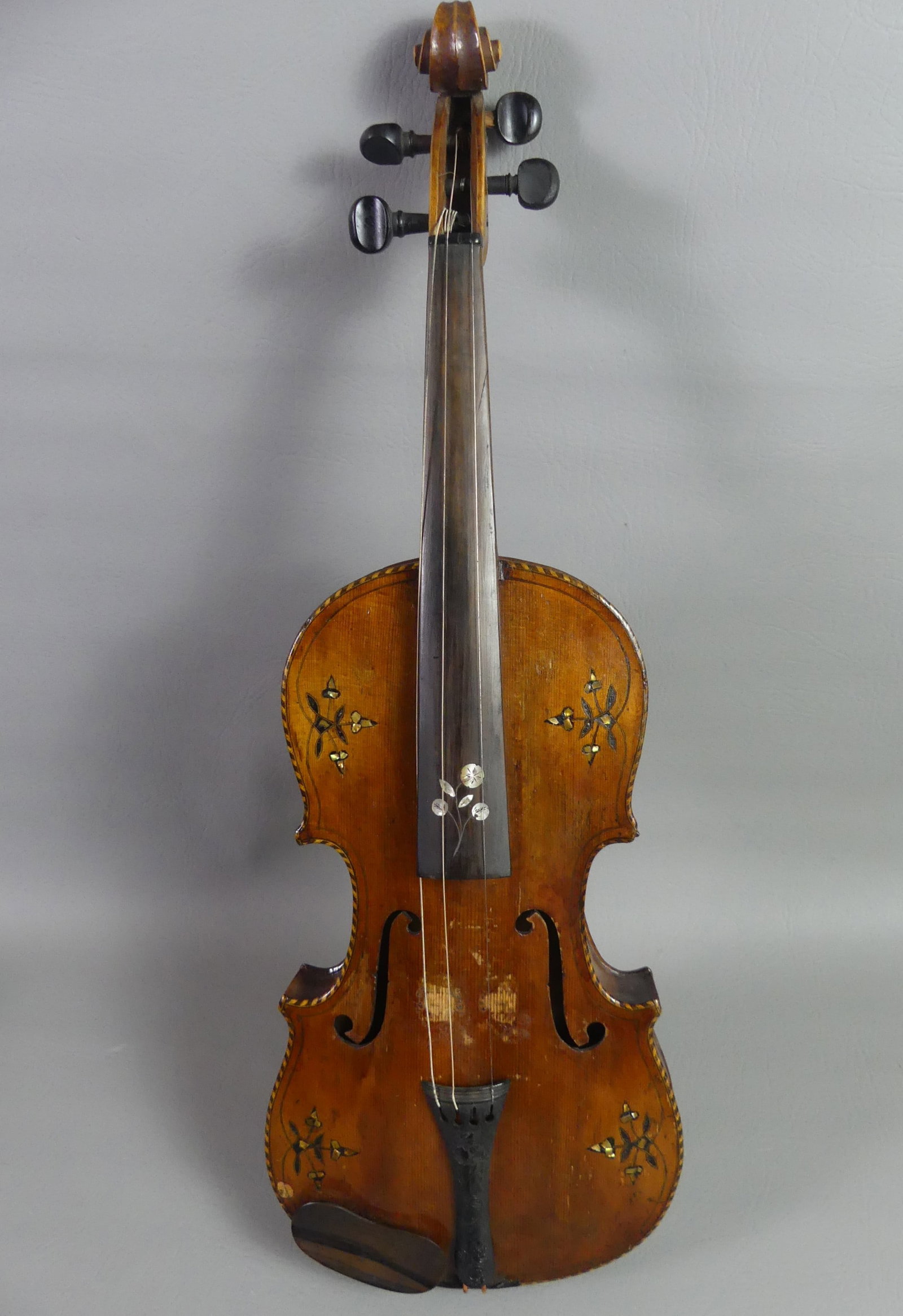 ANTIQUE MOTHER OF PEARL INLAID VIOLIN: Antique wood violin, highly inlaid with floral designs in abalone, not signed. 23.5 in long. In hard case.