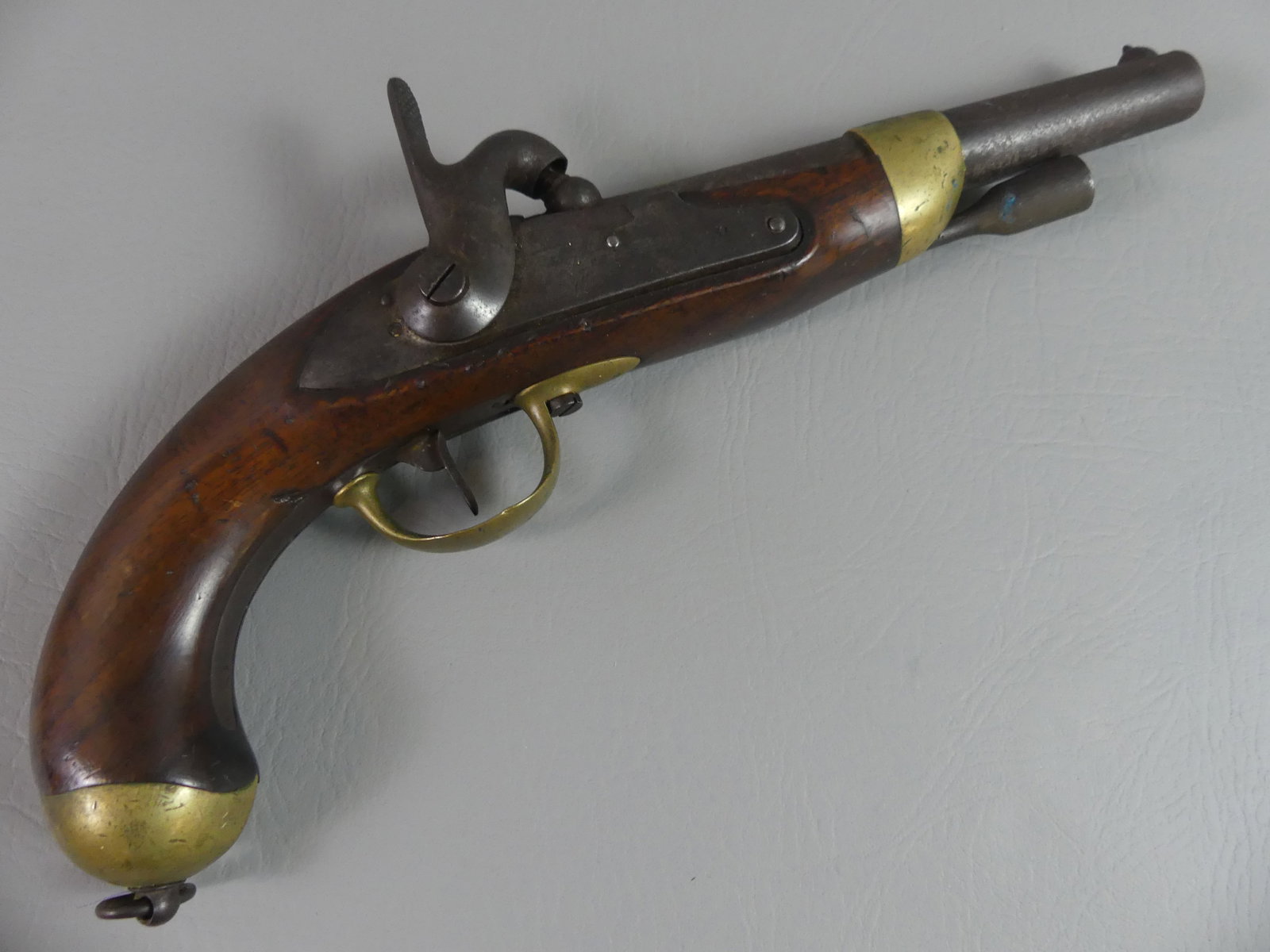 1853 FRENCH PERCUSSION PISTOL: Antique French naval percussion pistol signed on lock plate Mre Rle de Tulle and dated 1853 on barrel. Brass and walnut stock, about 70 caliber, 14 in long with 7.75 in barrel.
