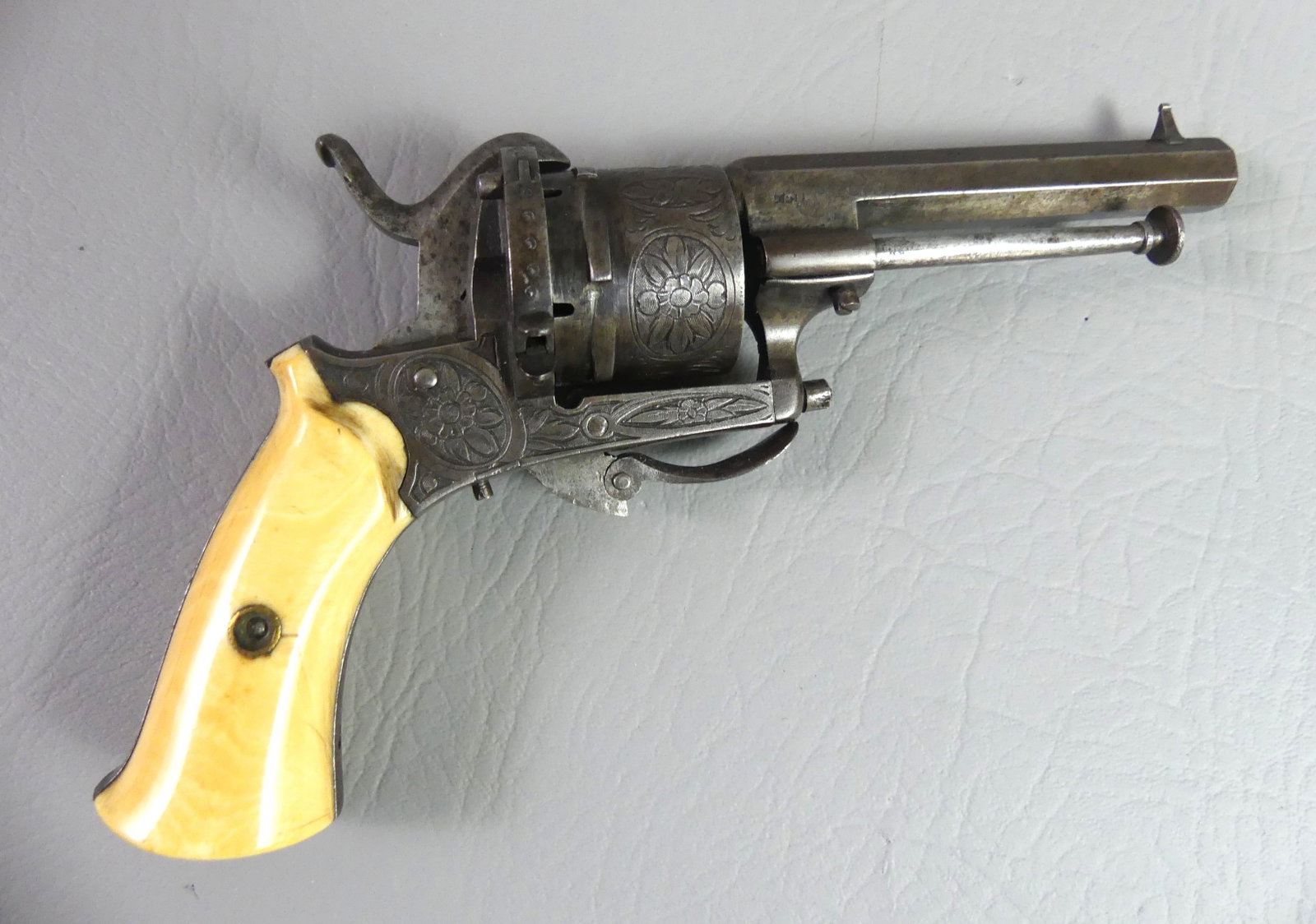 FRENCH PIN FIRE REVOLVER - BONE GRIPS: French 19th century engraved coat pin fire revolver with bone grips, 7.5 in long, barrel is 3.25 in. About 25 caliber. Good mechanics.