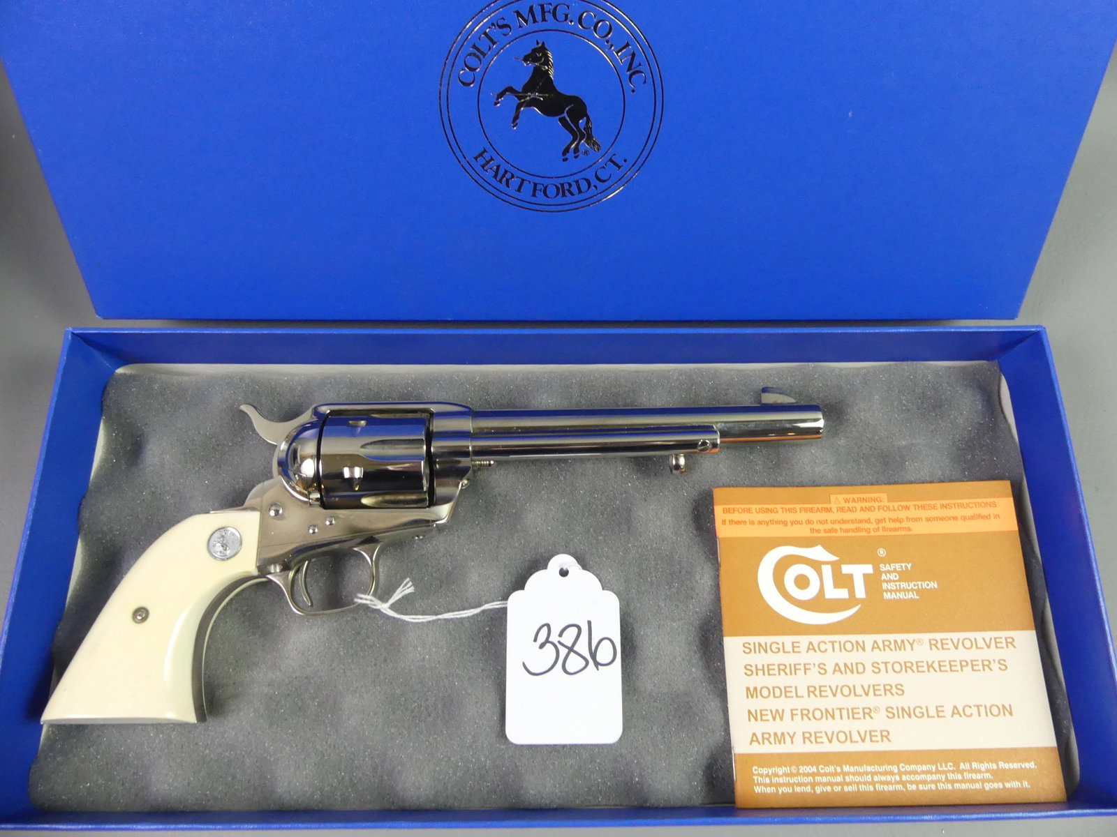 COLT SINGLE ACTION ARMY 45 REVOLVER: Colt Single Action Army 45 revolver (reissue) with bone grips and nickel plated finish. Barrel is 6.5 in long. Serial number S41534A. Original box and manual. Fine condition, good mechanics. NOTE: By 
