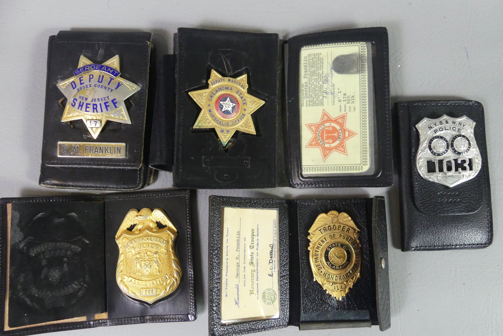 5 OBSOLETE POLICE BADGES: Lot of 5 obsolete, vintage police badges, originally belonging to George Franklin. Includes: Honorary State Trooper for Alabama; NY Veterans Police Association #1568 (1979); Sergeant, Deputy Sheriff o