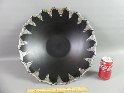 EMILIA CASTILLO BOWL - BIRDS IN FLIGHT: Large black glazed pottery centerpiece bowl with silver overlay, shaped rim of parrots in flight signed Emilia Castillo, Plata Pura Mexico, 95/2. Size: 17.5 in diameter and 5 in high. Excellent