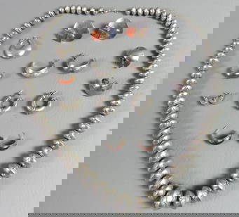 LOT MEXICAN SILVER JEWELRY: Lot of Mexican sterling silver jewelry including 5 pairs of earrings and 3 single earrings; plus a 30 inch long flattened disk necklace. Total 7 ozt.