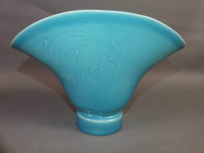 ROOKWOOD POTTERY VASE WITH FACE 6839: Old Rookwood art pottery fan-shaped vase in blue glaze with incised design of a woman's face on one side. Mold number 6839, date mark for 1946. 7.5 in tall x 11 in wide. VG condition.