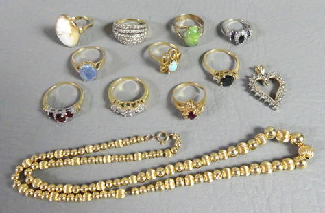 10 GOLD GEMSTONE RINGS & NECKLACE: Lot of 10 assorted gold gemstone rings plus 18 in 14k gold bead necklace (3.3 dwt) and diamond-inset 10k gold heart pendant. The 10k rings are: 5 rows of diamonds size 9; triple ruby ring size 8.5;