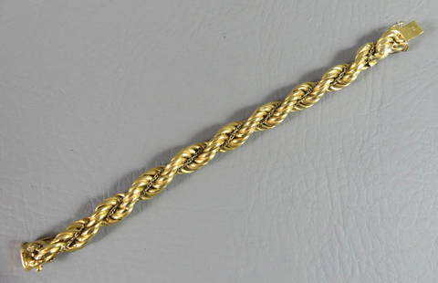 18K GOLD HEAVY BRAIDED BRACELET: Heavy 18K yellow gold bracelet with braided chains design. 7 inches long. 18.4 dwt.