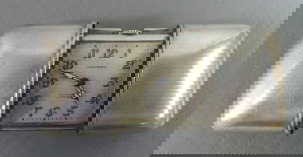 MOVADO SILVER TRAVEL WATCH: Small Movado travel clock in sterling silver slide-open case (stamped 935). Dial signed Movado, Chronometre Ermeto. Serial number 1190795. 2.75 in open, 1.5 x 1.85 in closed. Working. 43.6 dwt.