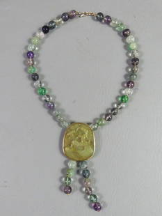 JADE NECKLACE WITH HORSE PENDANT: Chinese multi-color jade and quartz bead necklace with 2.25 in green jade horse pendant. 18 in long with 2.5 in drop.