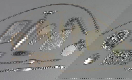12 STERLING JEWELRY ITEMS & ACCESSORIES: Lot of 12 sterling silver items including brooches, bracelets, match safe, note pad with pencil, etc. 7 ozt.