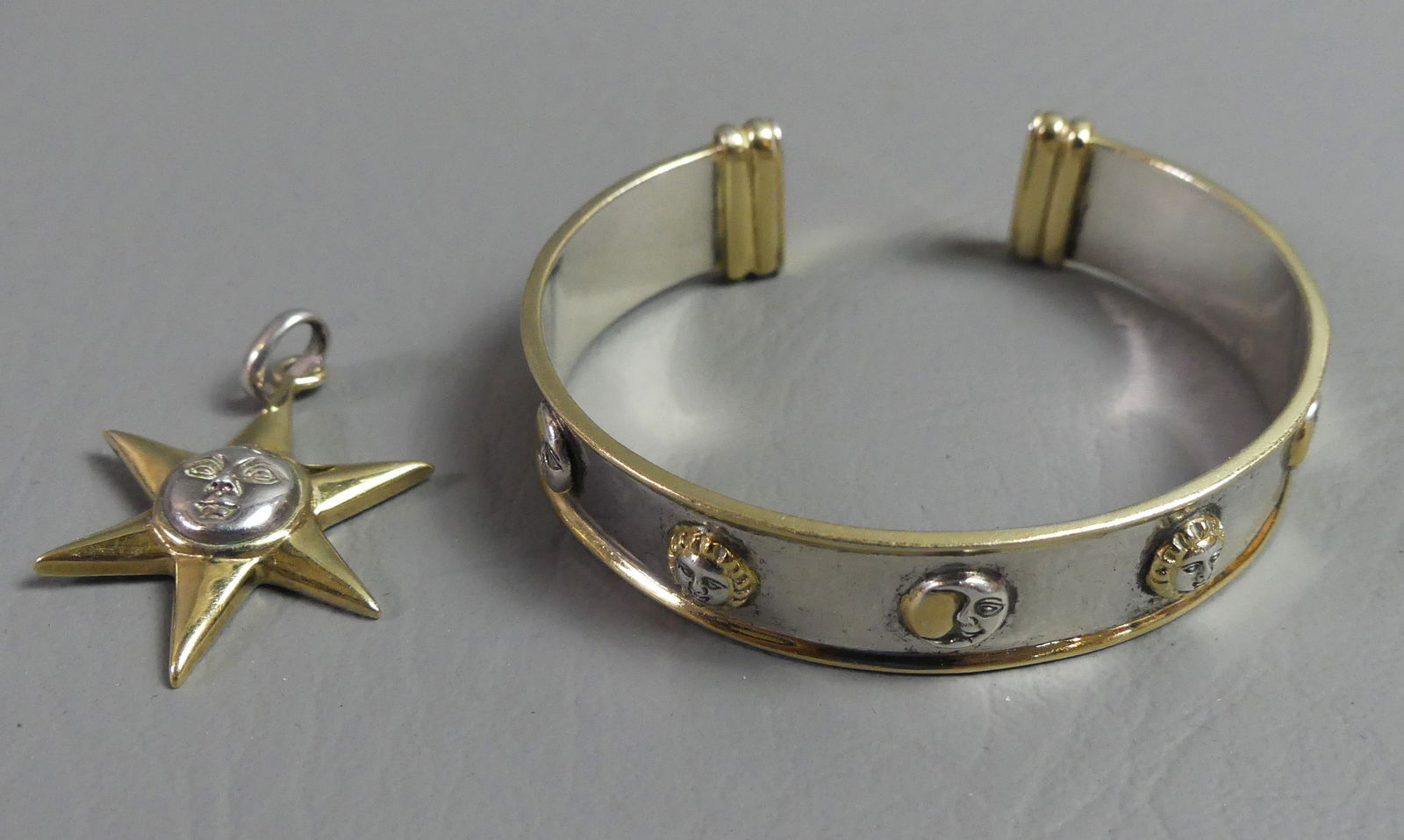 BUSTAMANTE STERLING BRACELET & PENDANT: Sergio Bustamante sterling silver 2 color sun pendant, 1.25 in long; and a bracelet with sun and moon designs by Bustamante stamped GAS 925 Mex. 23.8 dwt.