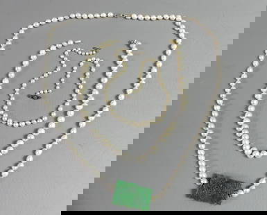 3 PEARL NECKLACES: Lot of 3 natural pearl necklaces - 17.5 in necklace with 14k clasp and 9.5 mm pearls; 32 in long with 2 inch carved jade pendant; and 17 in with graduated pearls and sterling silver clasp.