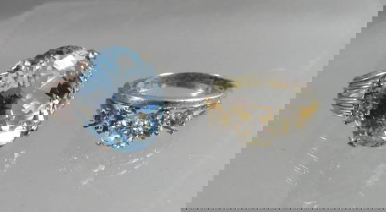 TWO 14K GOLD GEMSTONE RINGS: Lot of 2 gold gemstone rings in 14k gold: Light blue topaz or aquamarine with tiny diamonds, size 6; and white gold engagement ring with diamond and wedding band that has been bonded, size 7. Total