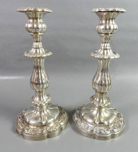 FANCY SILVER CANDLESTICKS: Pair of fancy silver continental candlestick holders. No marks. 800 or better silver. 28.9 ozt. Size: 11 in tall.
