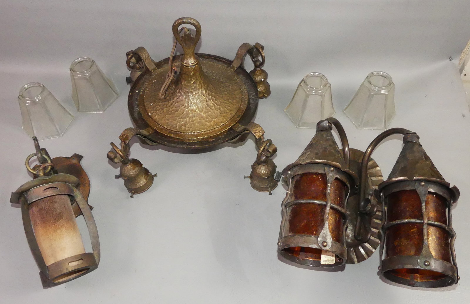 3 ARTS & CRAFTS LAMPS: Lot of 3 Arts and Crafts lamps: Nice period hand hammered 4 light ceiling fixture with 4 glass shades, 17 in diam; Period iron hand hammered electric wall sconce with 7 in mount; vintage iron double w