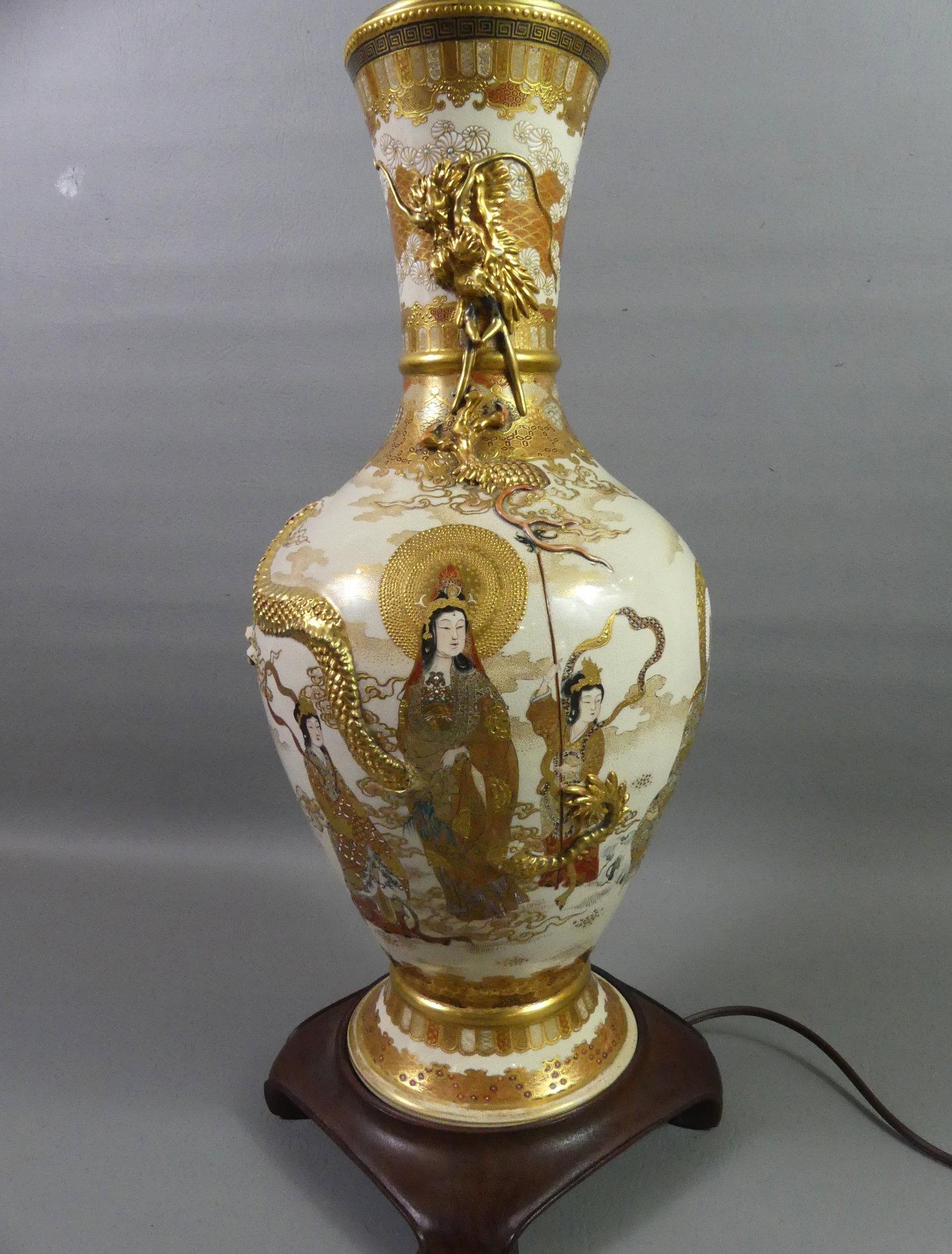 LARGE JAPANESE MEIJI LAMP: Exquisite Japanese Meiji period ceramic vase mounted as lamp with fine painted and gilt decoration of gods, goddesses, and children with embossed dragon around neck. 35 in tall to finial. VG condition