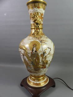 LARGE JAPANESE MEIJI LAMP: Exquisite Japanese Meiji period ceramic vase mounted as lamp with fine painted and gilt decoration of gods, goddesses, and children with embossed dragon around neck. 35 in tall to finial. VG