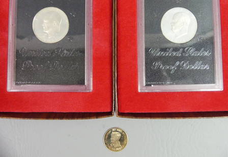 LINDBERGH GOLD COIN & EISENHOWER DOLLARS: Lot of coins: 50th Anniversary of the Charles Lindbergh flight coin in 10k gold, 25.4mm, weighs 2.8 grams; and two 1971 Eisenhower proof silver dollars in US Mint cases (40% silver content).
