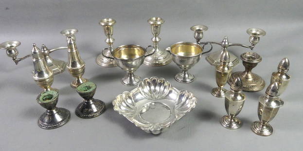LOT ASSORTED STERLING SILVER: Lot of mostly weighted sterling silver including 3 pairs of candlesticks; 3 pairs salt and pepper shakers and 5.5 in solid sterling bowl (3.55 ozt).