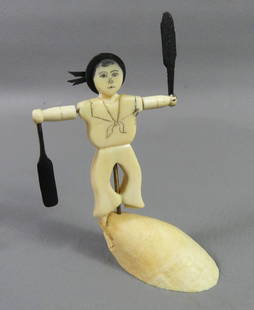 MINIATURE WHALEBONE WHIRLIGIG: Miniature carved whalebone whirligig of a sailor boy standing on rock. 4 in high x 2.25 in. From Nantucket, possibly by Nancy Chase.