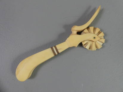 WHALEBONE PIE CRIMPER: 19th century whalebone pie crimper with 2 baleen strips and two-tine fork. 7 in long.