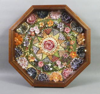 VINTAGE SHELL VALENTINE: Colorful vintage shell valentine in octagonal wood case with floral designs surrounding star center. 16 in diameter, 2 in deep. VG condition.