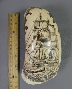 WHALE TOOTH - SHIP ESSEX BY MANGHIS: Large polychrome whale tooth titled WRECK OF THE ESSEX, signed Charles A. Manghis Nantucket 6/2000 and 9/2000. Depicts ship and whale on one side and legend verso. 18.4 oz, 5.75 x 2.75 inches.