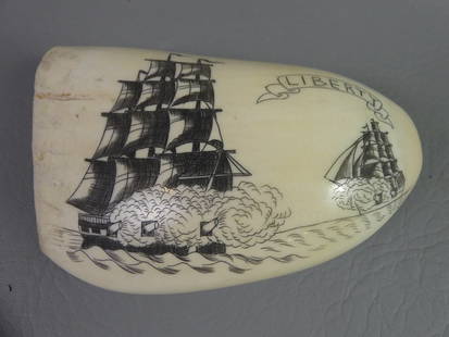 SCRIMSHAW WHALE TOOTH - LIBERTY: Large, wide whale tooth with scrimshaw of a naval battle with 2 ships and LIBERTY. 16.3 oz, 5 x 3 inches.